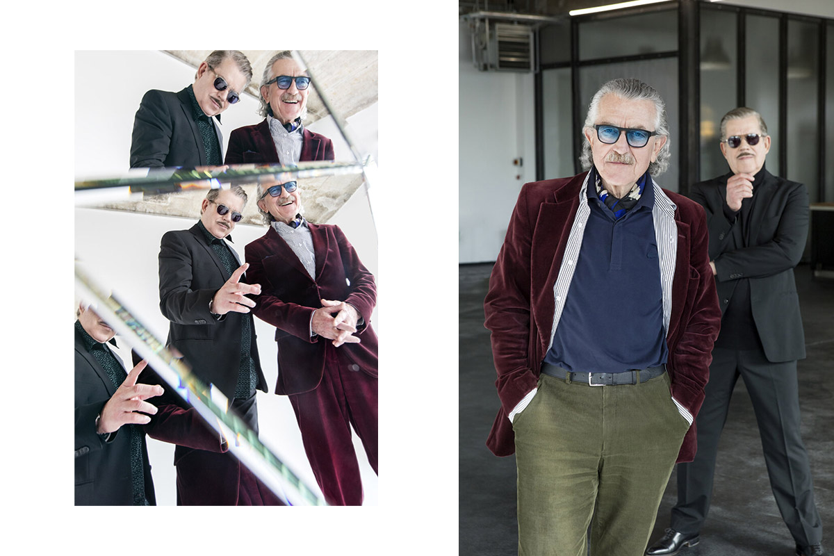 YELLO by Sobiralski at raw studios 04 A split-frame composition: on the left, YELLO is reflected in a multi-faceted mirror, adding an abstract, avant-garde feel; on the right, Dieter Meier stands in front of an industrial-style window while Boris Blank poses in the background, adding depth to the scene.