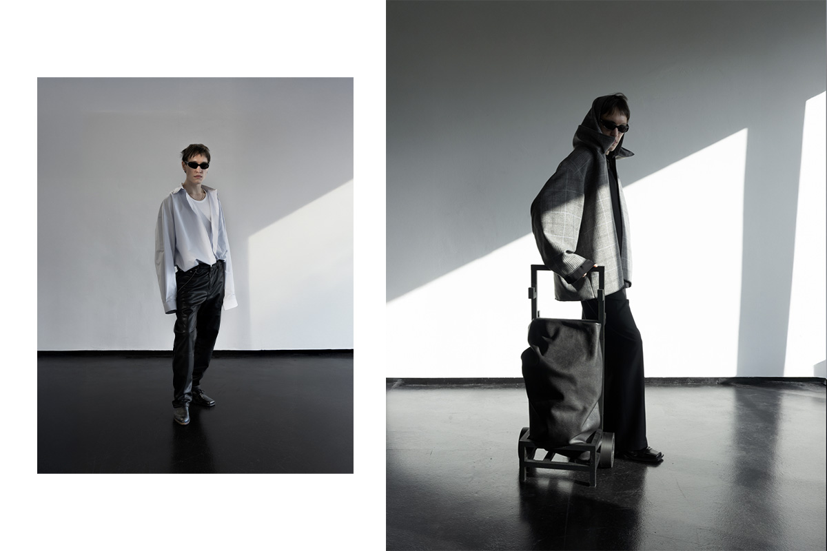 Left: Model in a crisp oversized shirt and dark trousers stands in front of a white wall with soft window light. Right: Model in a checked coat with a sculptural black trolley bag is backlit by strong geometric sunlight at raw studios.