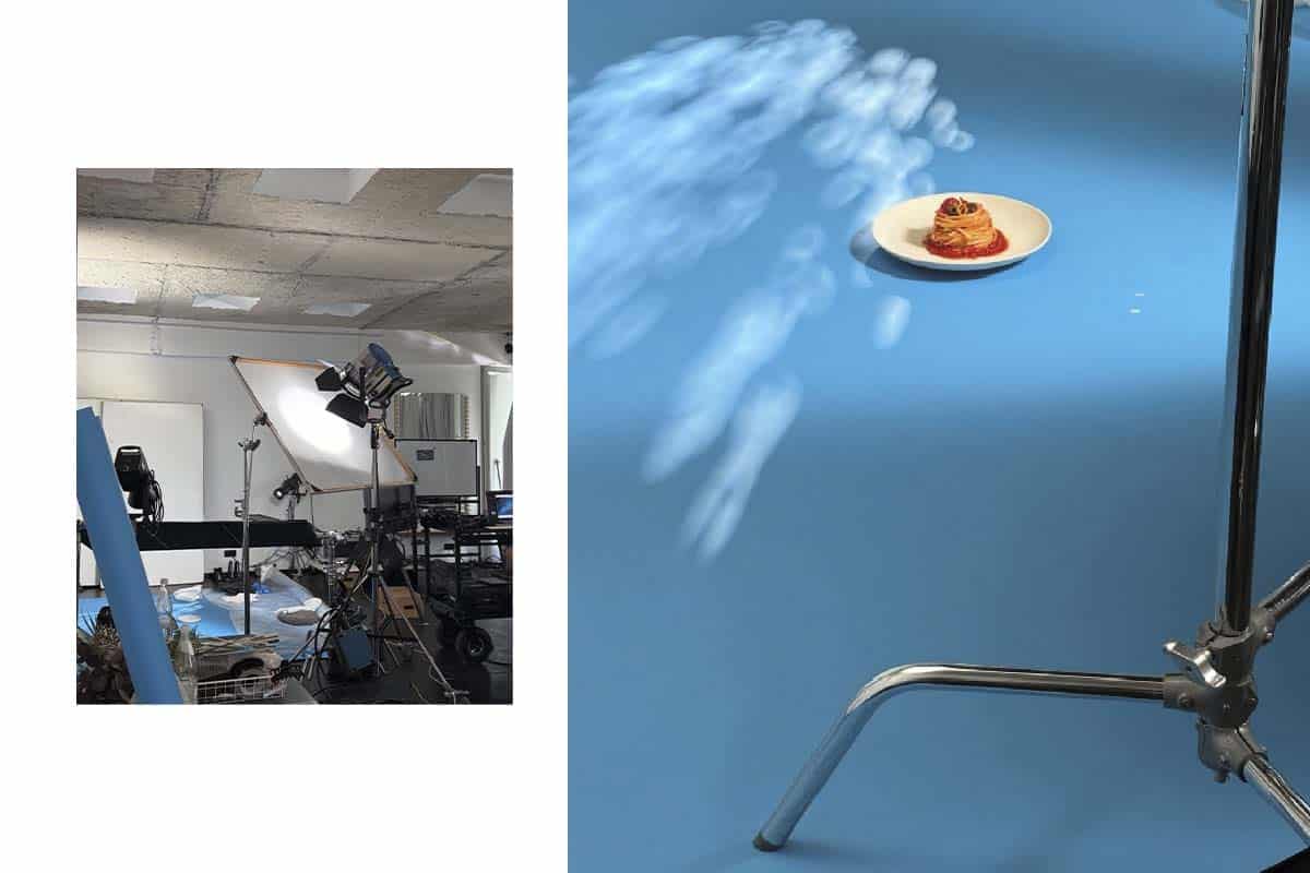 Behind-the-scenes view of ALDI Nord campaign production at raw studios Berlin, showing lighting setup and blue backdrop for food styling.